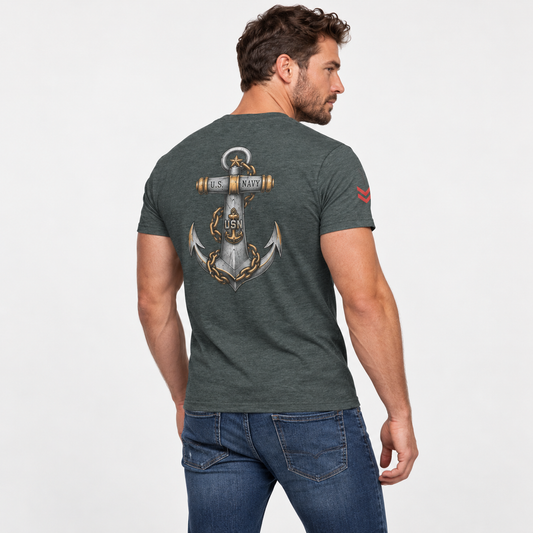 A man wearing a dark heather gray t-shirt with a large anchor graphic on the back, paired with blue jeans, photographed from behind against a light gray studio background.