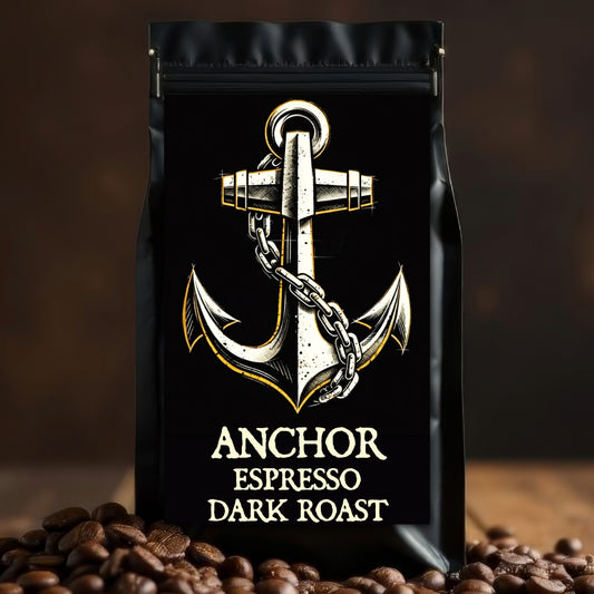 Black coffee bag with anchor design and 'Anchor Espresso Dark Roast' text on a wooden surface with coffee beans.