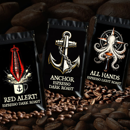 Three coffee bags with different roast types on a bed of coffee beans. Veteran-owned espresso coffee bundle with dark roast, light espresso roast, and African espresso blend roasted to order