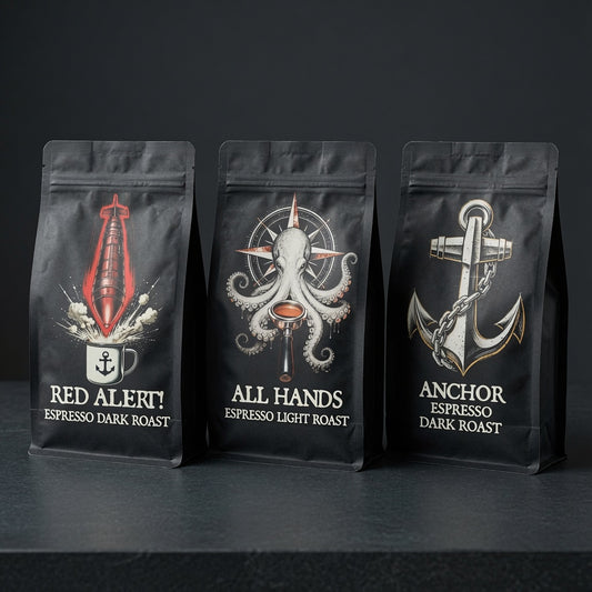 Three coffee bags with maritime-themed designs on a dark background
