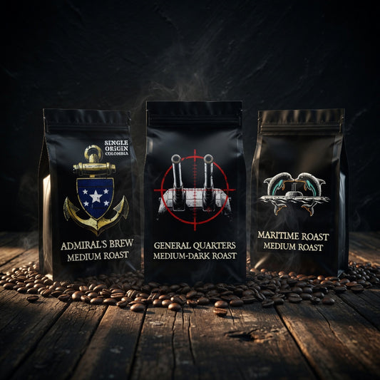 Three black coffee bags with different designs and text on a wooden surface with coffee beans.