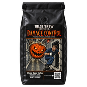A bag of Bilge Brew Coffee Co. Damage Control pumpkin spice flavored coffee, featuring a black bag with a detailed illustrated label showing a man peeking out from a door behind a glowing jack-o'-lantern.