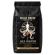 A black coffee bag from Bilge Brew Coffee Co. featuring a detailed illustration of an octopus holding espresso portafilter, with the text 'ALL HANDS' and 'SWEET BLONDE ESPRESSO ROAST' on a white background.