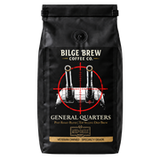 A black coffee bag from Bilge Brew Coffee Co. featuring a graphic of two naval guns inside a red crosshair, with the text 'GENERAL QUARTERS' and a gold banner reading 'VETERAN OWNED - SPECIALTY GRADE'.