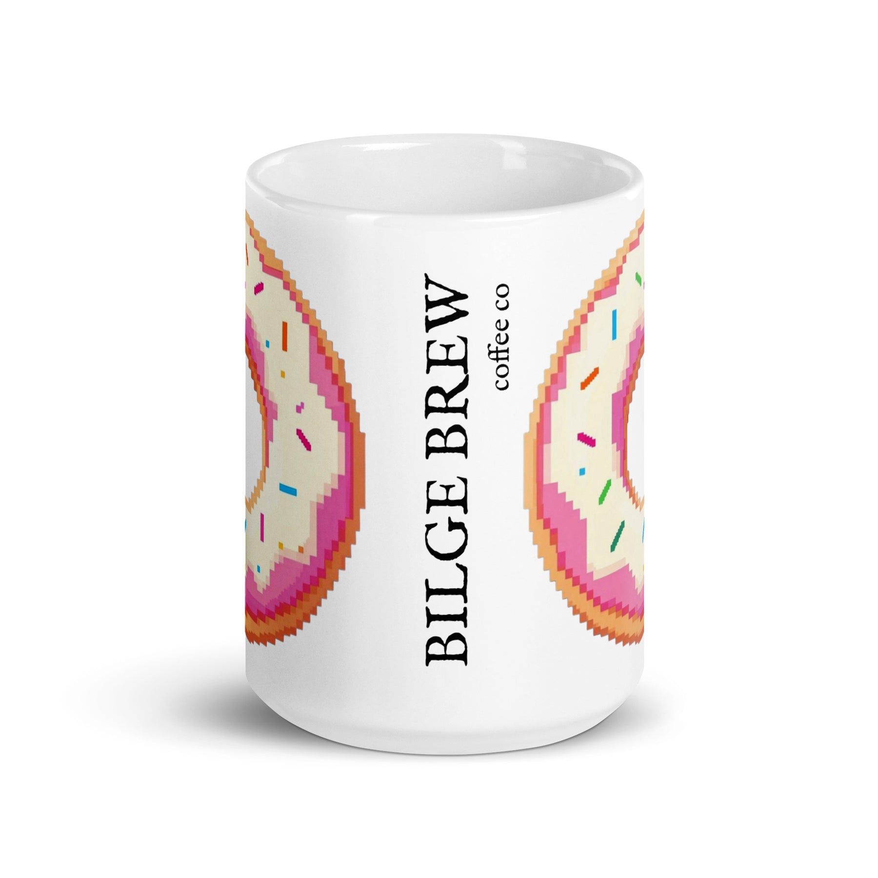 A white ceramic coffee mug featuring a pixel-art donut design in pink, orange, and beige with colorful sprinkles, alongside the vertical text 'BILGE BREW coffee co'.