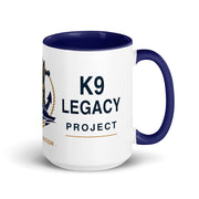 A white ceramic coffee mug with a dark navy blue interior, handle, and printed text reading 'K9 LEGACY PROJECT' alongside a navy and gold emblem, shown on a clean white background.