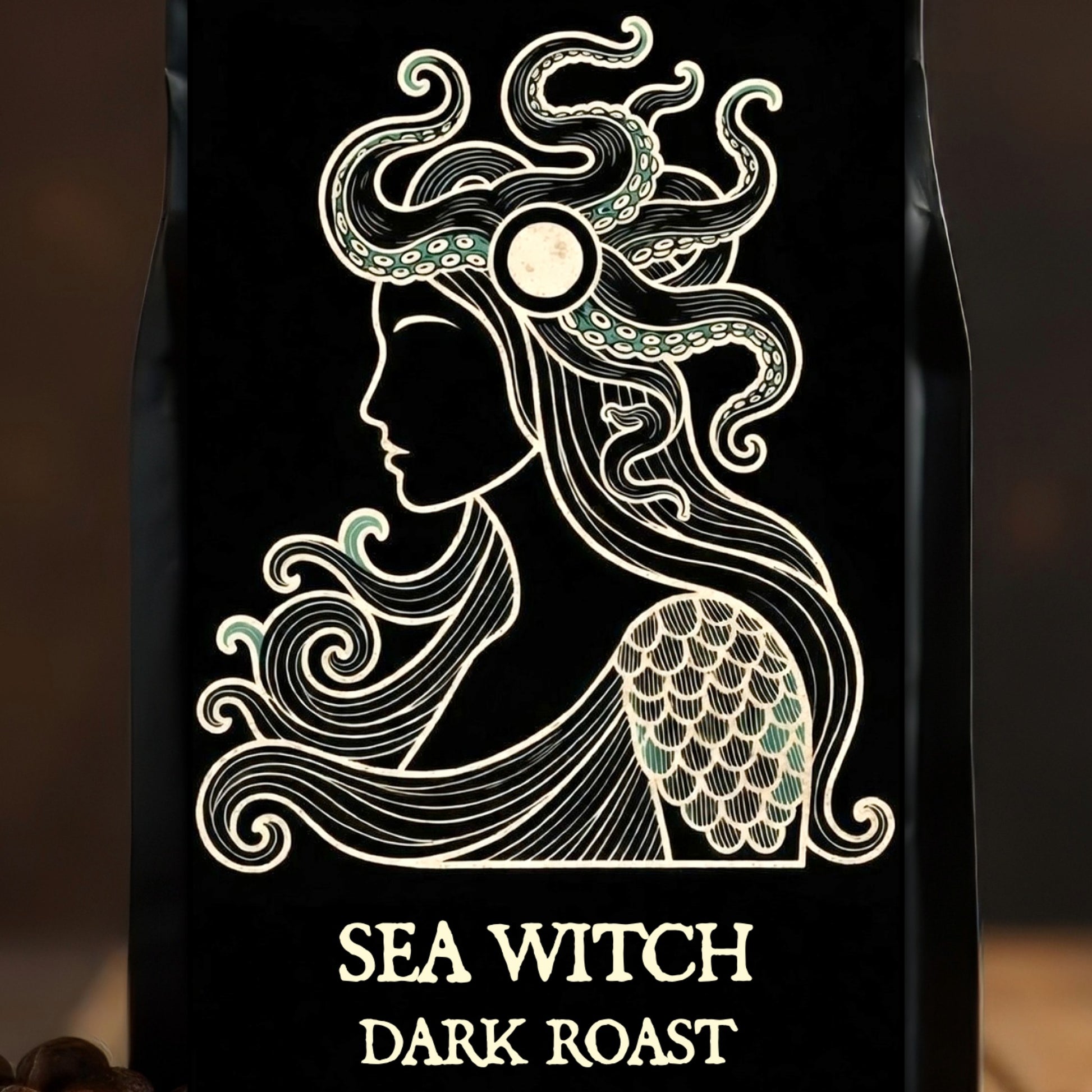 Coffee bag with 'Sea Witch Dark Roast' design featuring a stylized mermaid on a black background.
