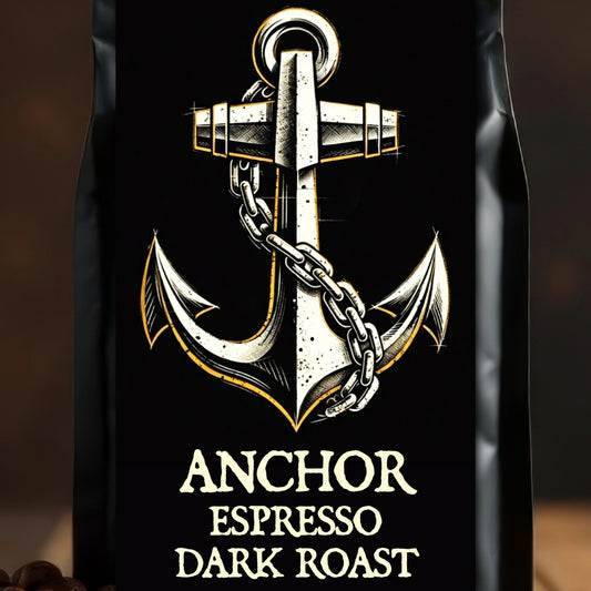 Black coffee bag with anchor design and 'Anchor Espresso Dark Roast' text on a wooden surface with coffee beans.