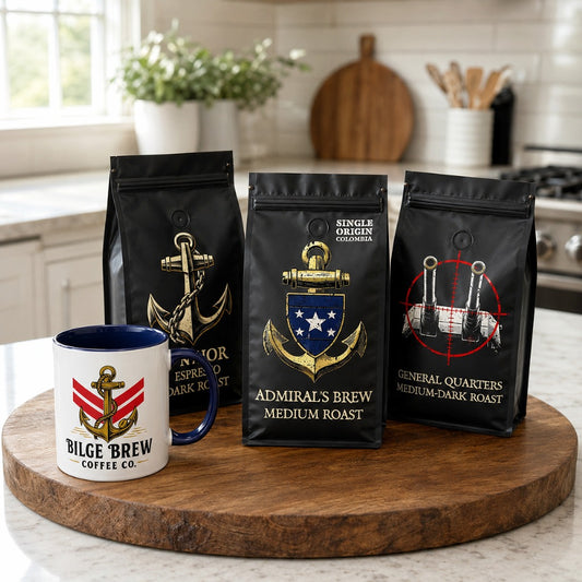Three bags of Bilge Brew Coffee Co. coffee roasts displayed on a round wooden serving board next to a matching ceramic mug in a bright kitchen setting.
