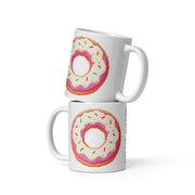 Two stacked white ceramic mugs featuring a pixel-art style pink frosted donut with colorful sprinkles, shown on a clean white background.
