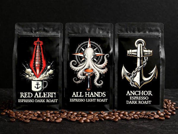 Three coffee packages with distinct designs and roast labels on a dark background with scattered coffee beans.