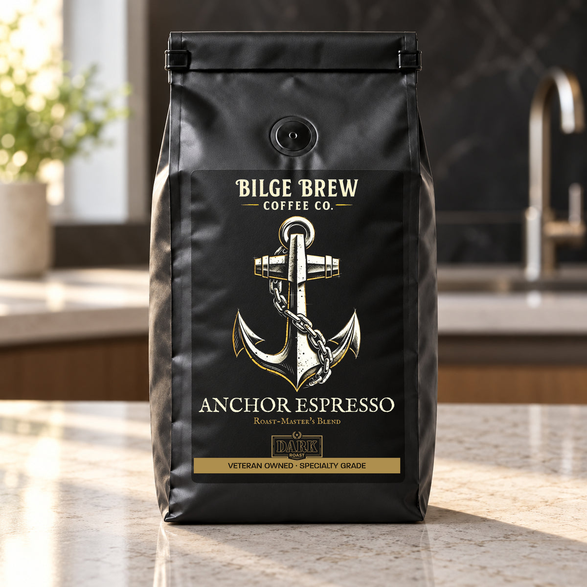 A black bag of Bilge Brew Coffee Co. Anchor Espresso standing on a light stone countertop in a kitchen setting.