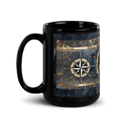 Black mug with a nautical design featuring a compass rose on a white background