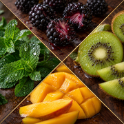 A four-quadrant close-up collage of fresh fruits on a dark wooden surface: blackberries, sliced kiwi, cubed mango, and mint leaves with water droplets.