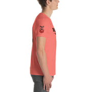 Person wearing a red t-shirt with a logo on a white background