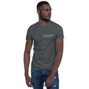 Man wearing a dark gray t-shirt with a logo on a white background