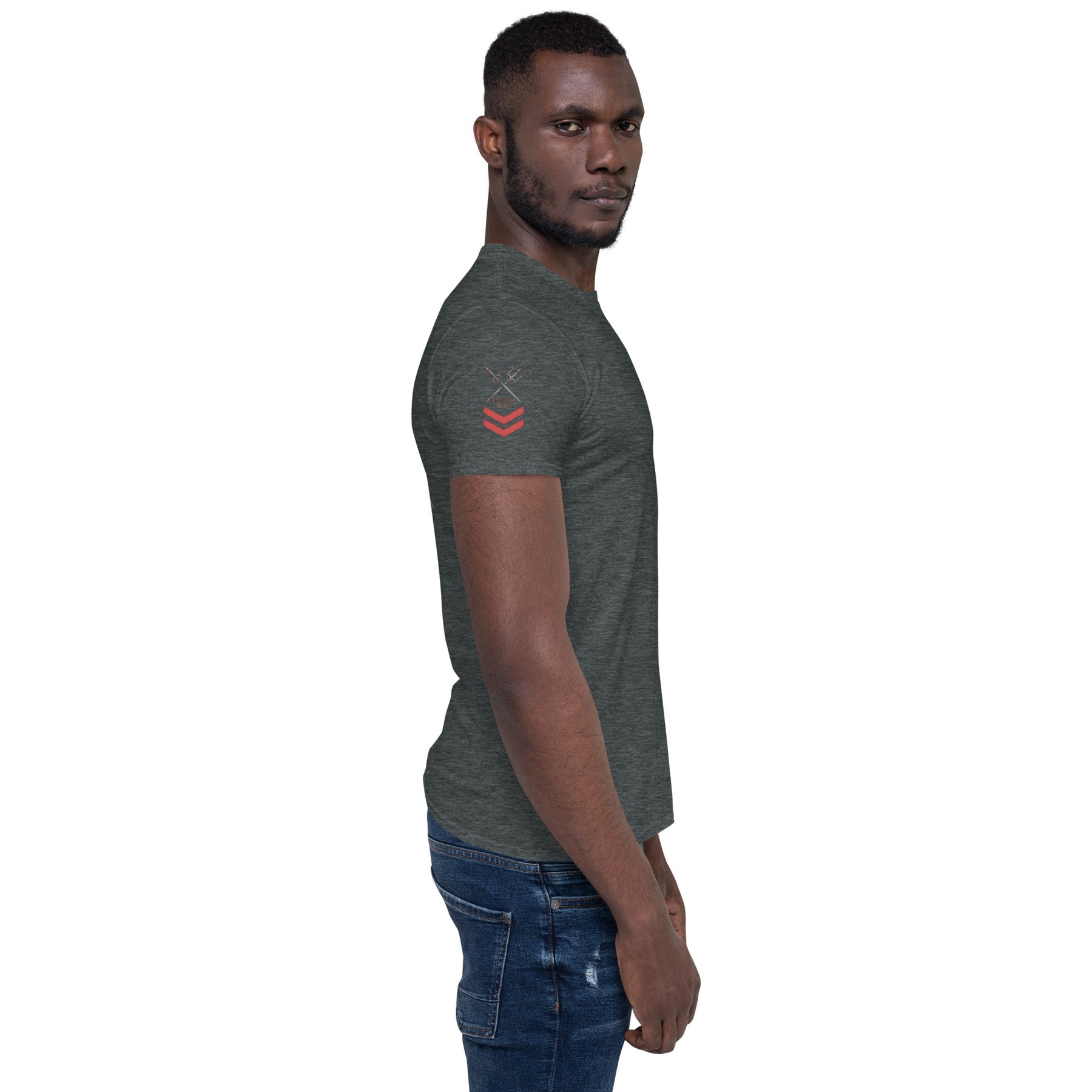 Man wearing a dark gray t-shirt with a logo on a white background