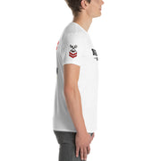 Person wearing a white t-shirt with graphics and text on a white background