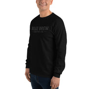 Person wearing a black long-sleeve shirt with 'REV360' logo on a white background