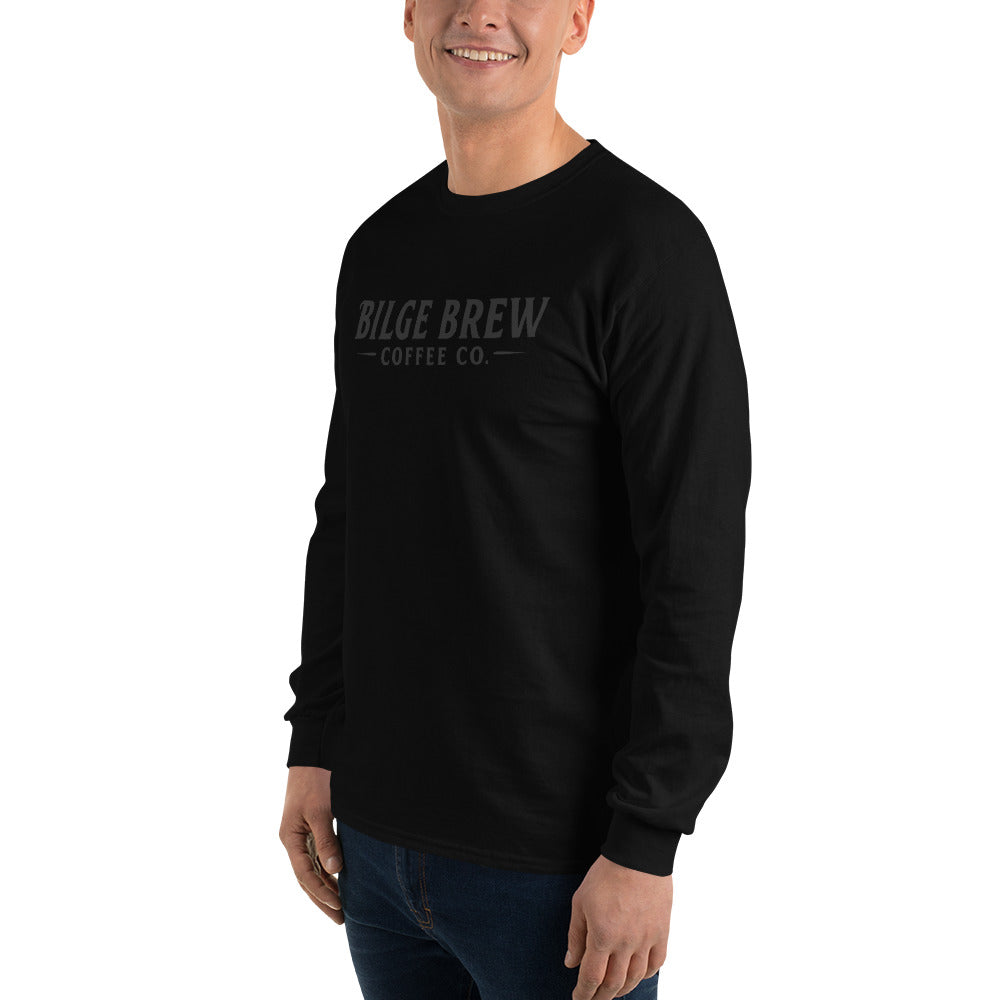 Person wearing a black long-sleeve shirt with 'REV360' logo on a white background