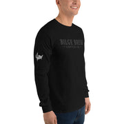 Person wearing a black long-sleeve shirt with logos on a white background