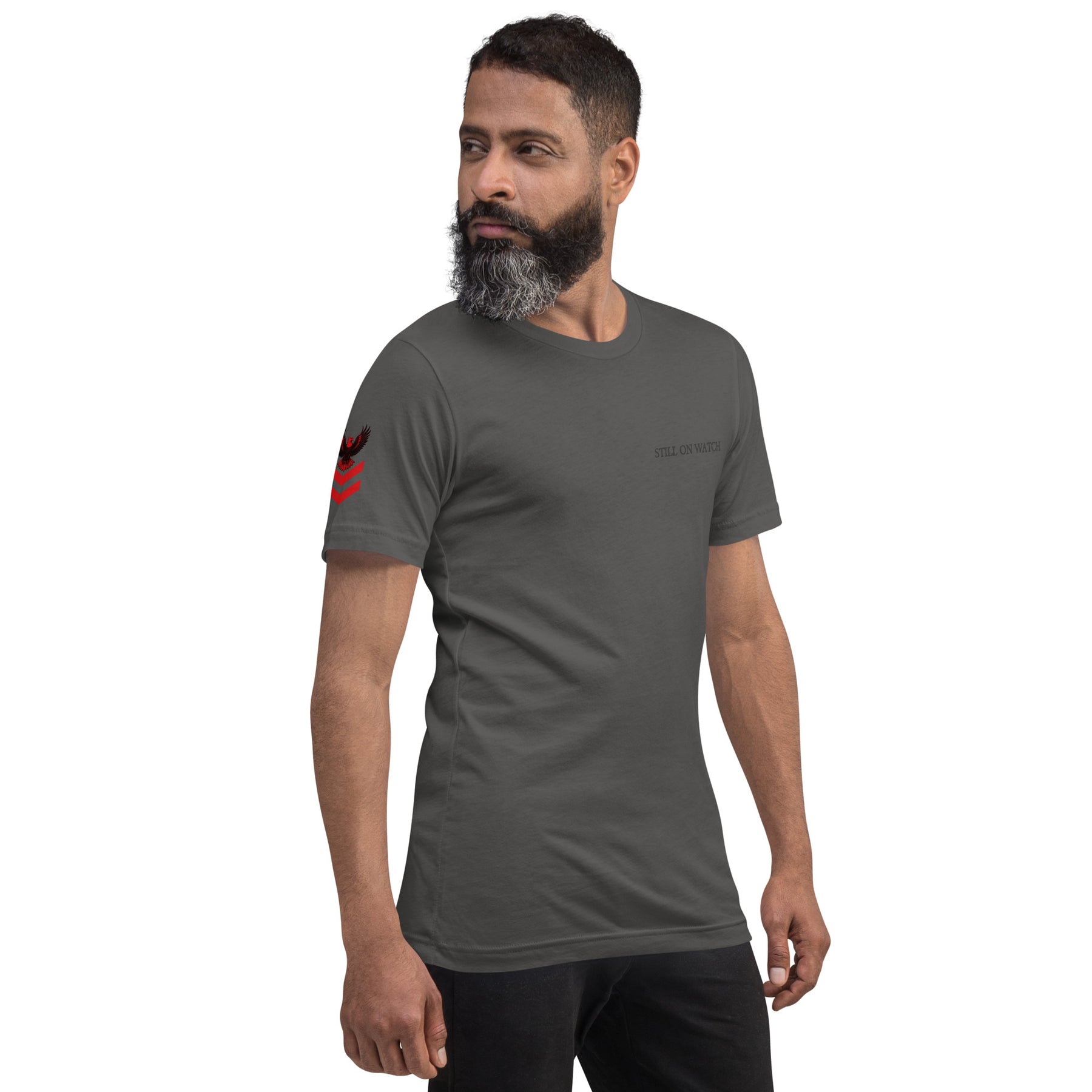 Man wearing a dark gray t-shirt with a logo on a white background