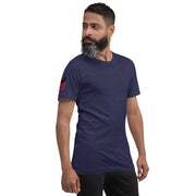 Man wearing a navy blue t-shirt with a red and black design on a white background