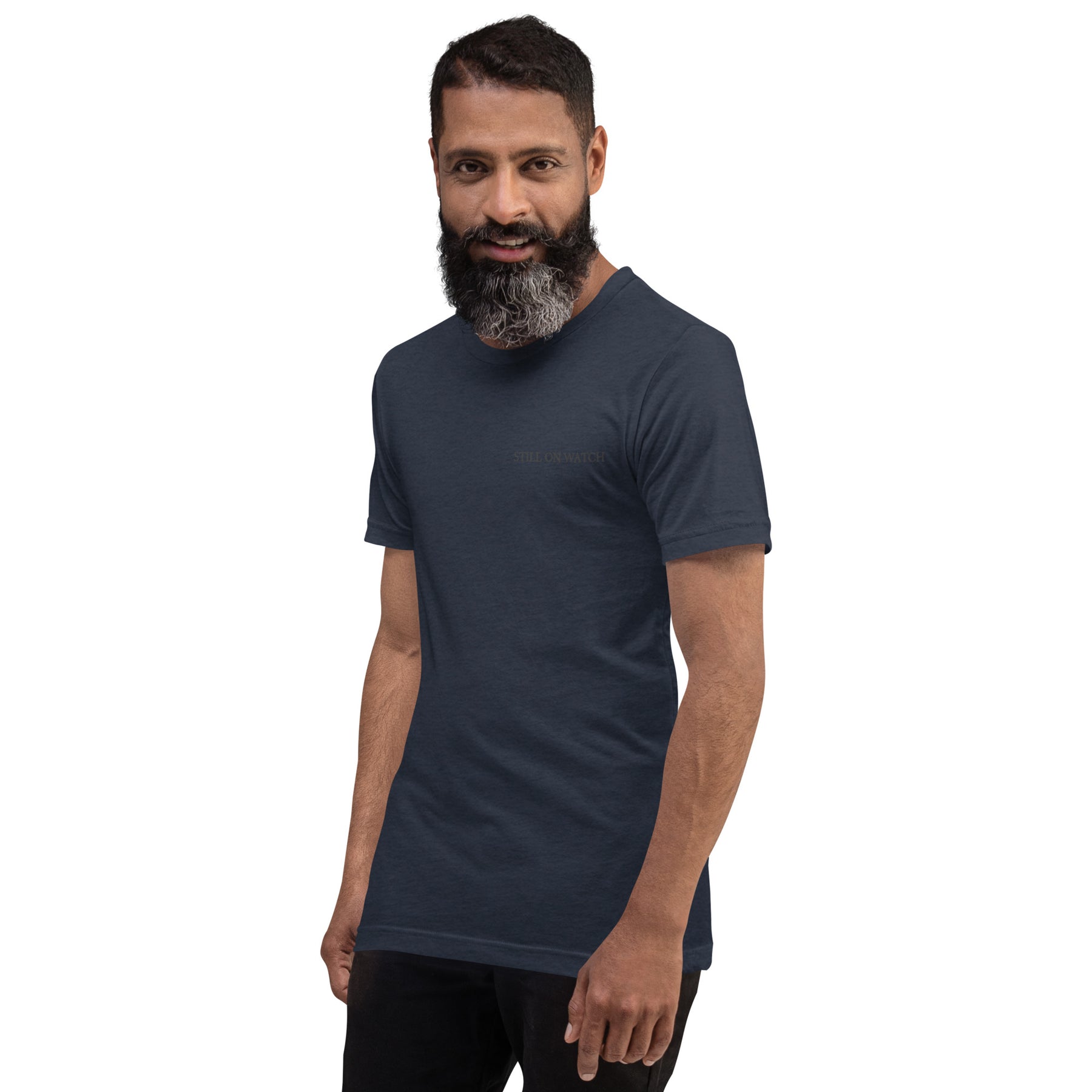 Man wearing a dark blue t-shirt with a logo on a white background