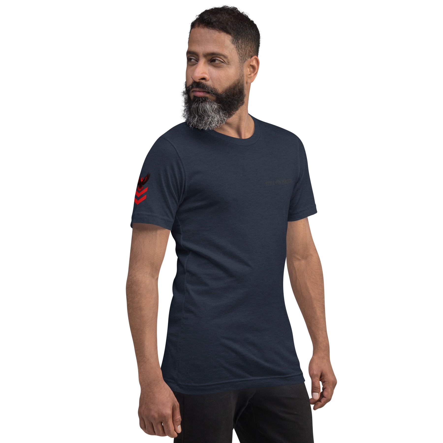 Man wearing a dark blue t-shirt with a red logo on a white background