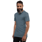 Man wearing a blue t-shirt with a logo on a white background