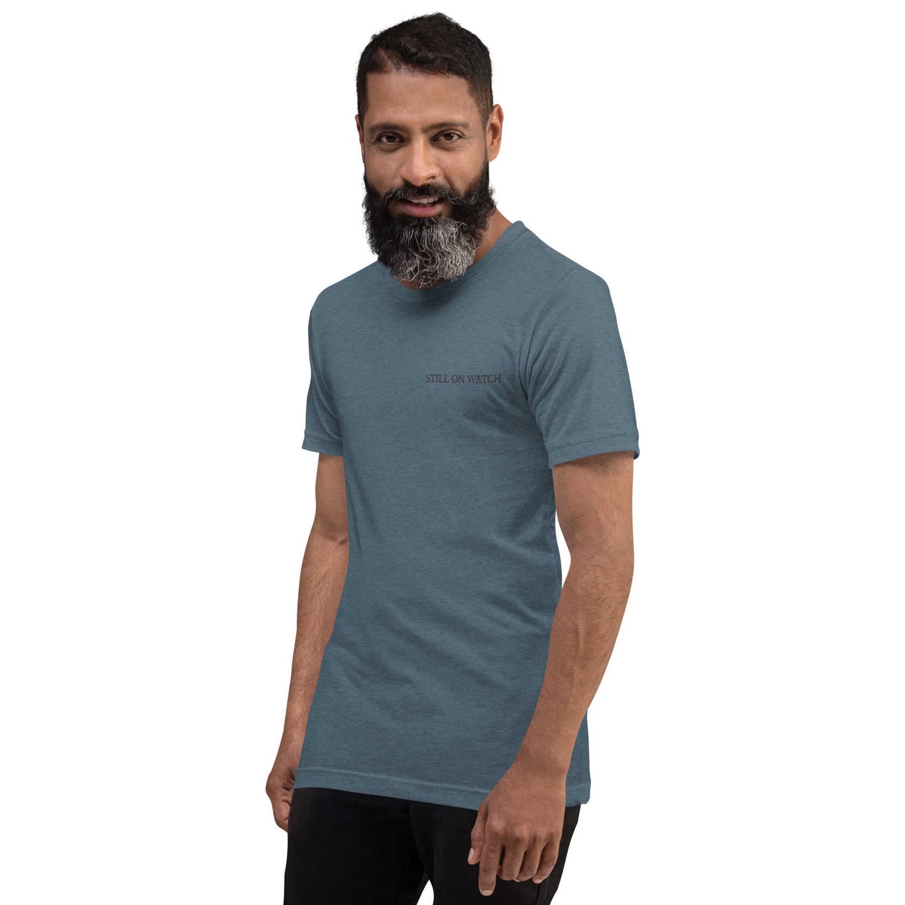 Man wearing a blue t-shirt with a logo on a white background