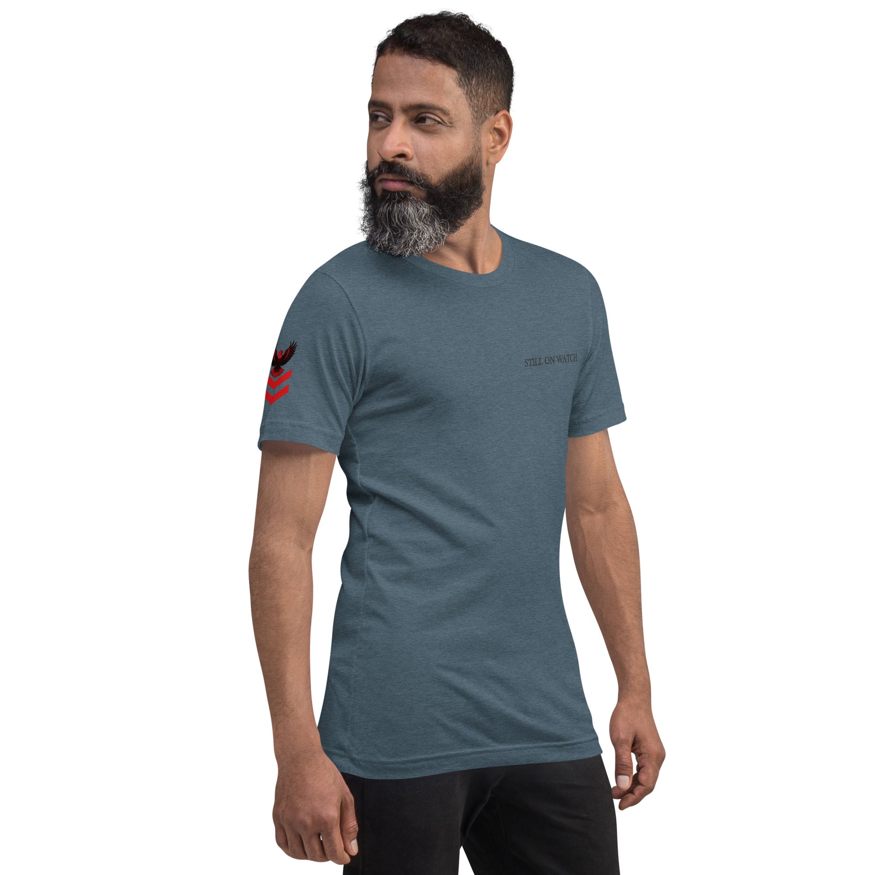Man wearing a blue t-shirt with a logo on a white background