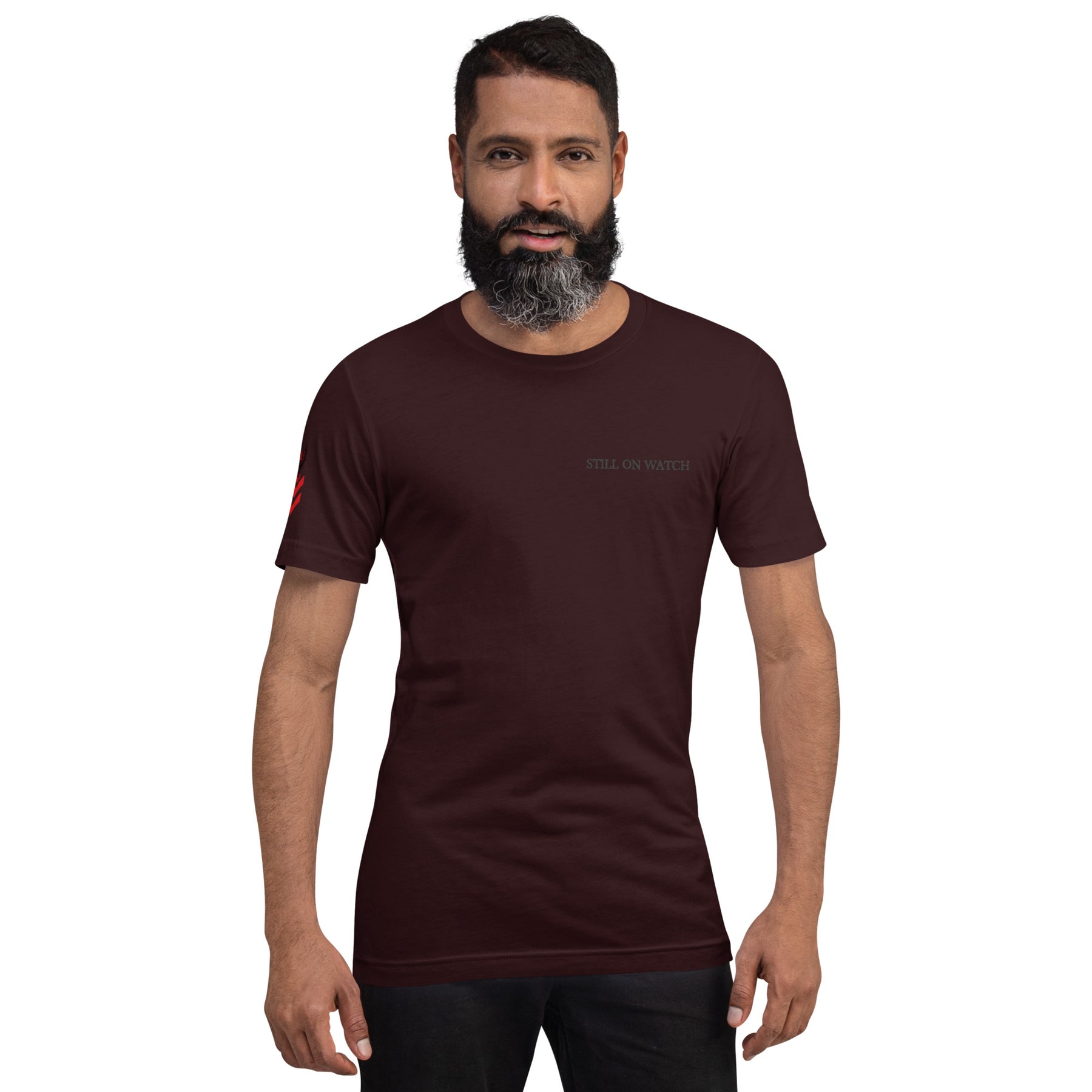 Man wearing a dark brown t-shirt with red graphics on a white background