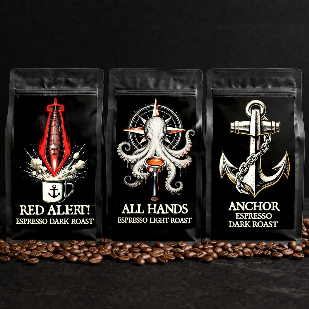 Three coffee packages with maritime-themed designs on a black background with coffee beans.