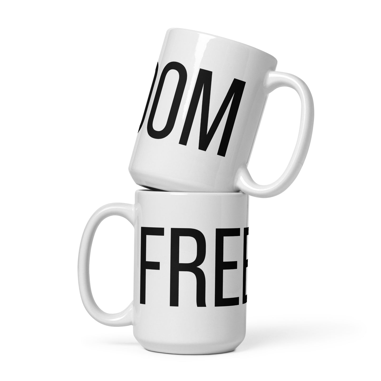 White FREEDOM ceramic mug – angled view