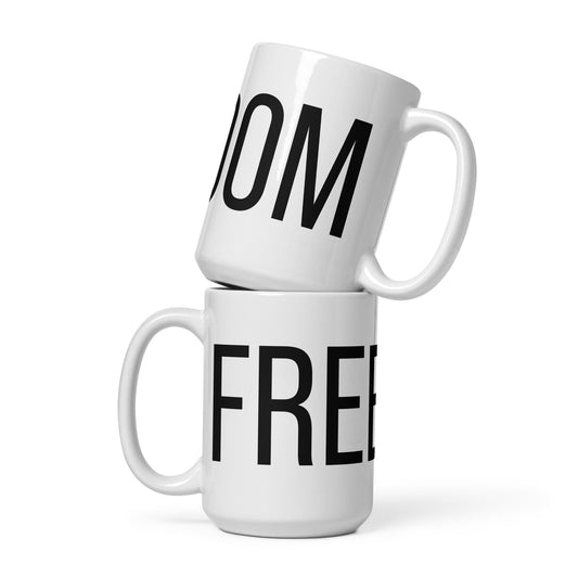 White FREEDOM ceramic mug – angled view