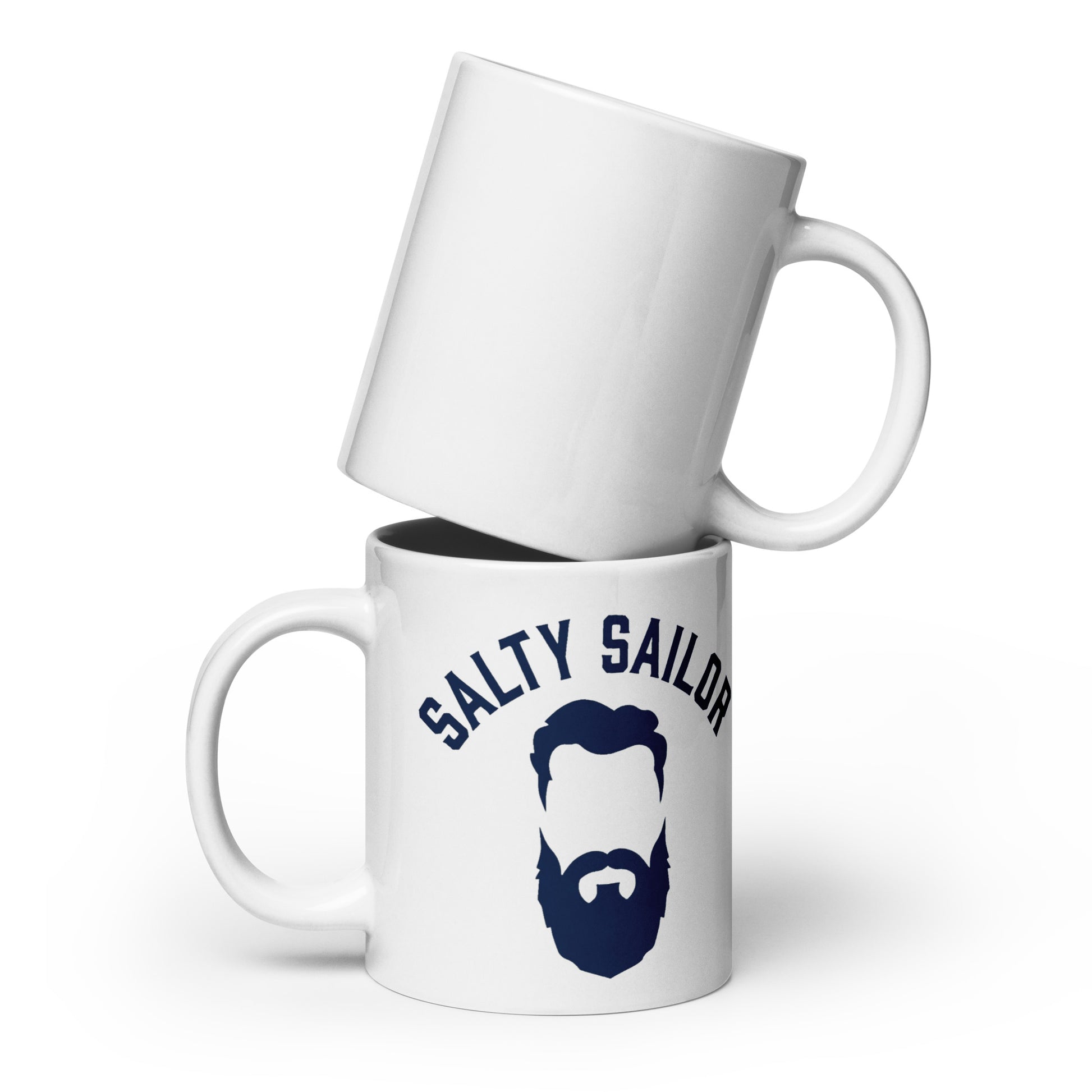Two white mugs stacked on a white background, with one mug featuring 'Salty Sailor' text and a beard graphic.